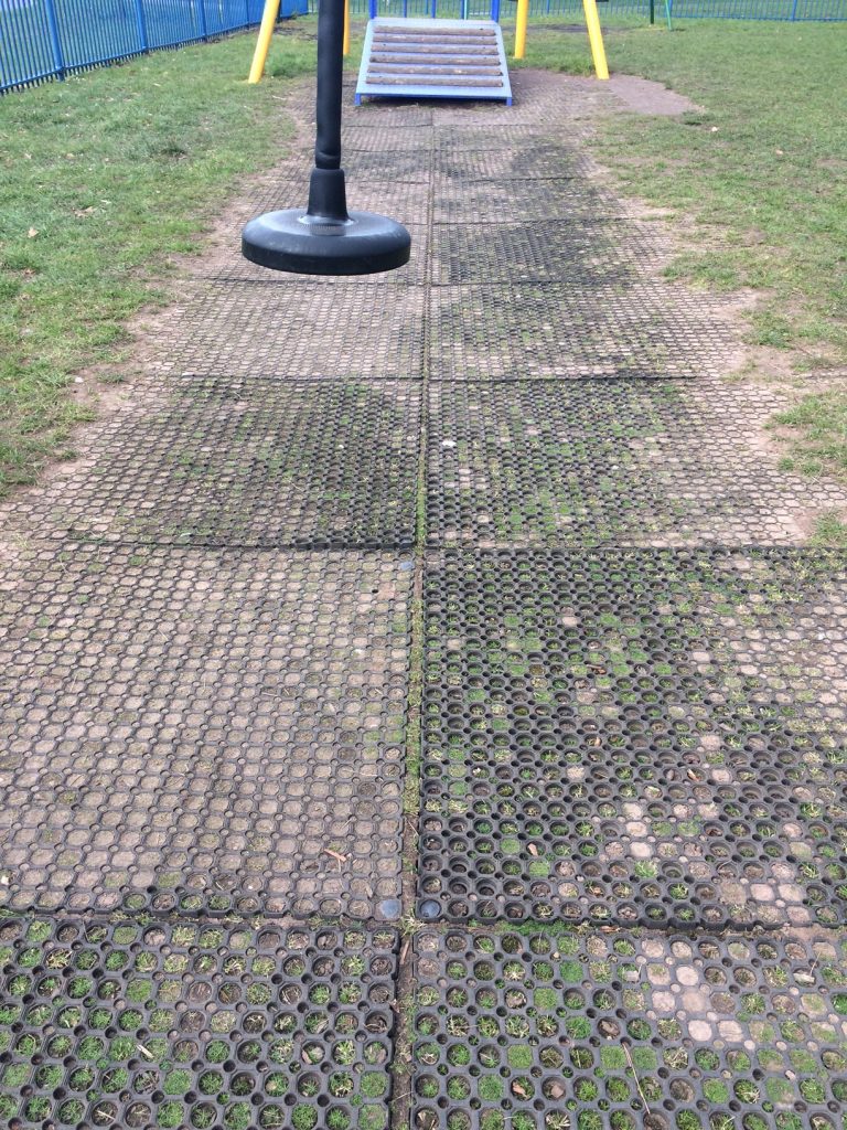 Poorly installed grass mats coming apart