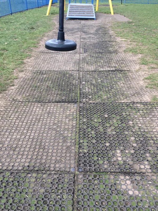 Poorly installed grass mats coming apart