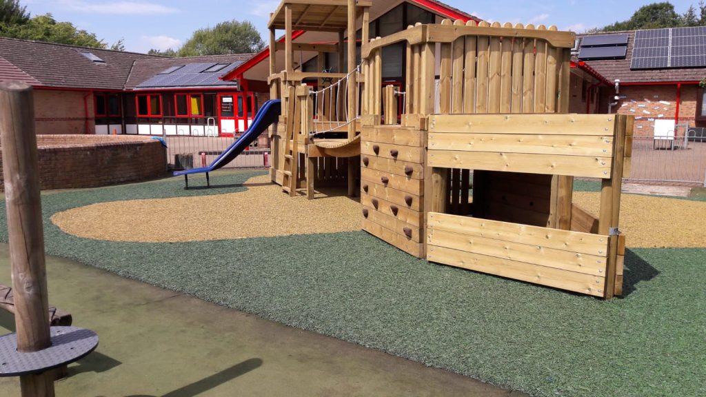 Green and yellow rubber mulch installed in school playground