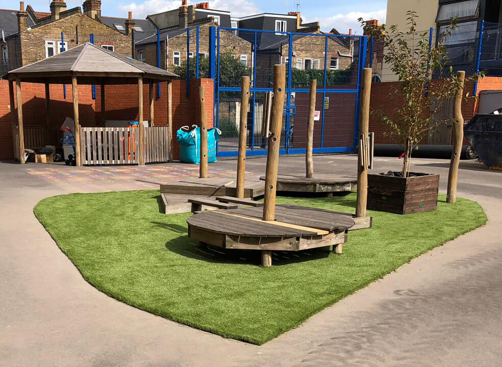 Artificial Grass under wooden equipment