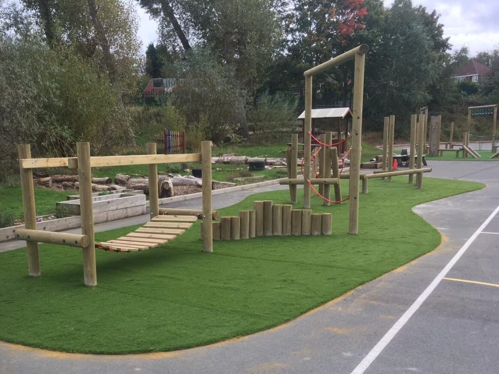 Artificial Grass underneath wooden trim trail
