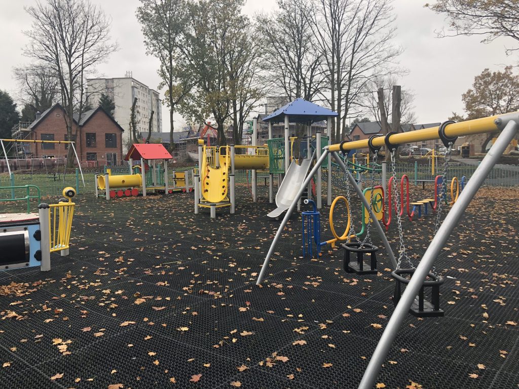 Grass mats underneath playground equipment