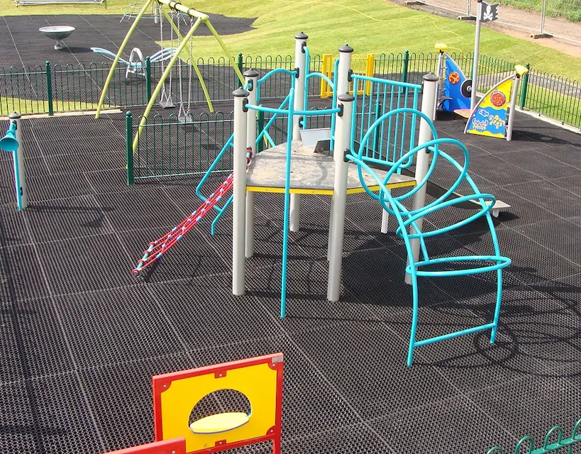 EcoSmart playground grass mats underneath Playground Equipment in Playground