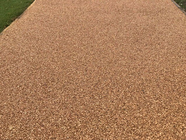Close-up on sand-coloured Corkeen flooring, showing its texture