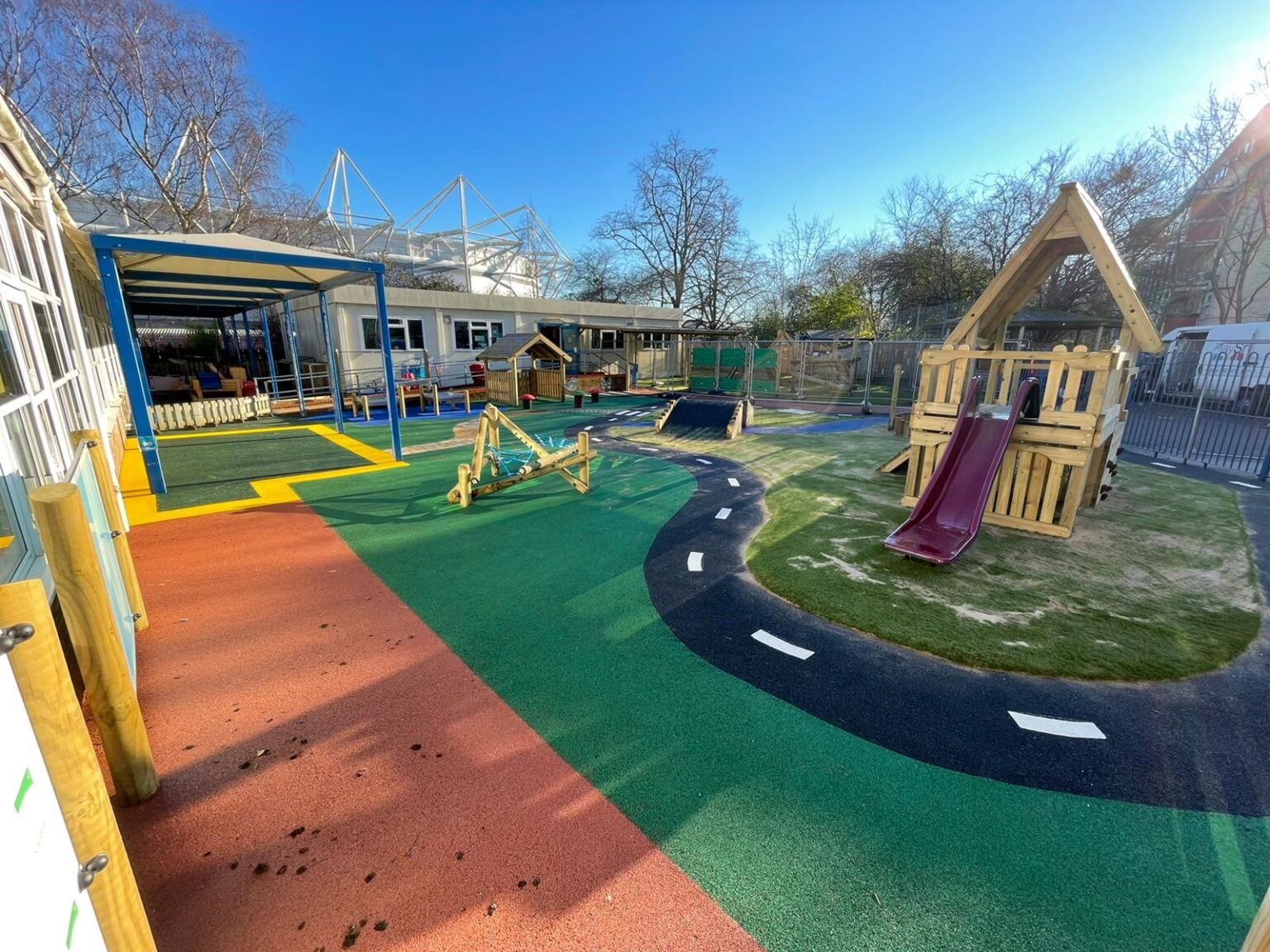 Playground race track and play structure