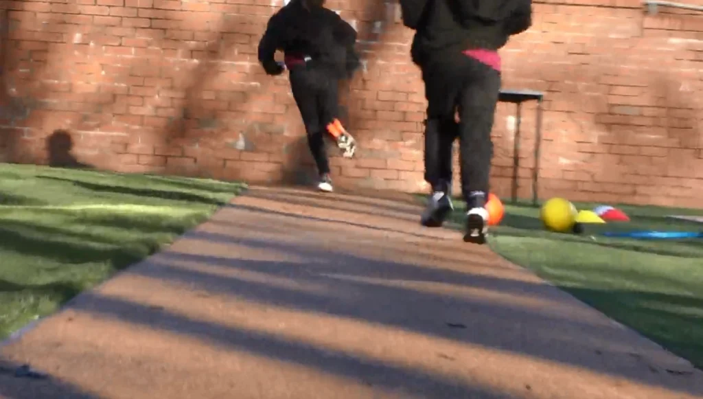 Two children running on a Corkeen pathway