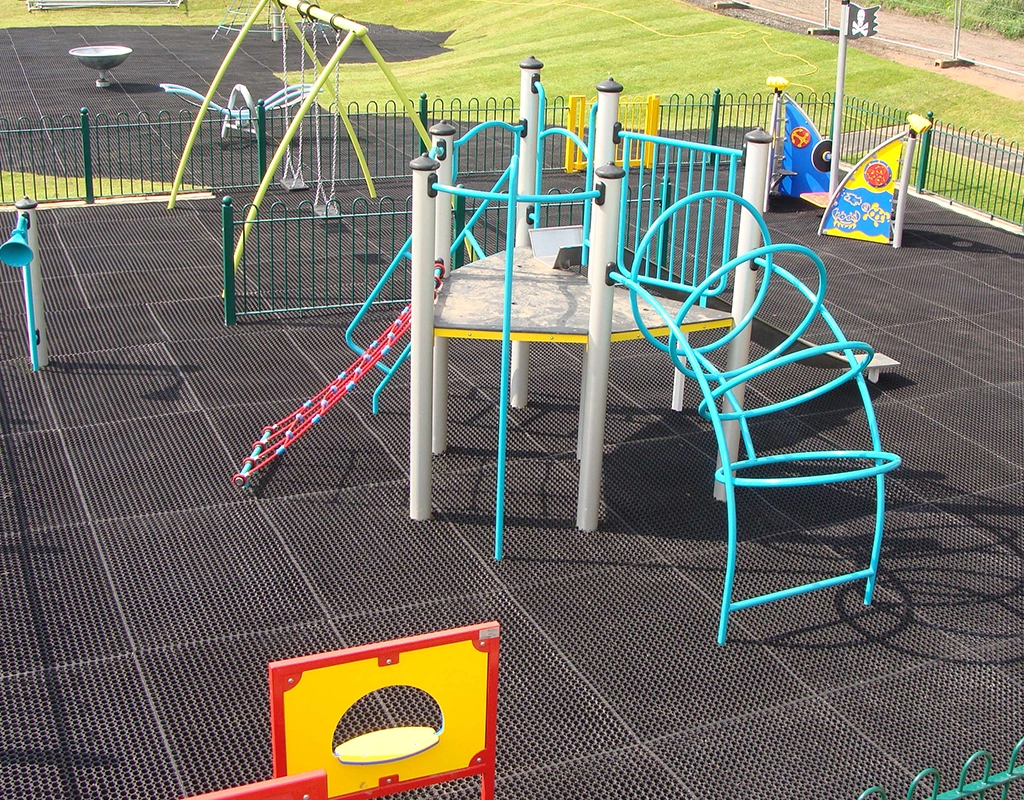 EcoSmart playground grass mats underneath Playground Equipment in Playground