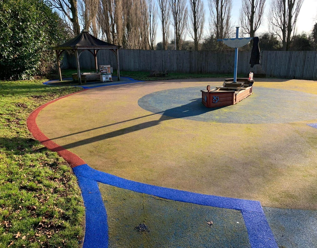 Colourful EPDM edging strips used at the edges of wet pour rubber play flooring