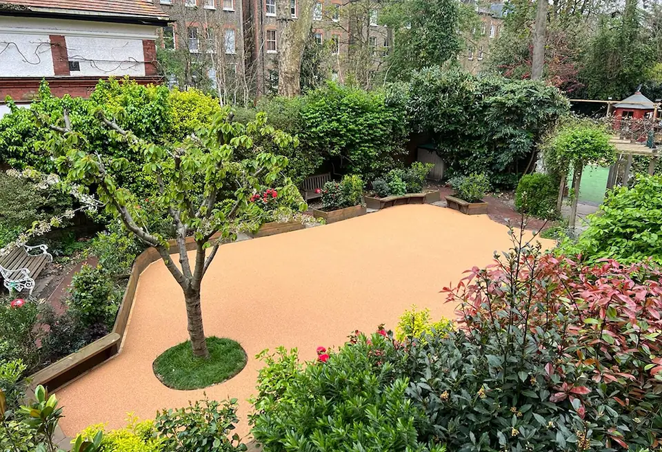 Corkeen installed in a school garden alongside trees and other vegetation