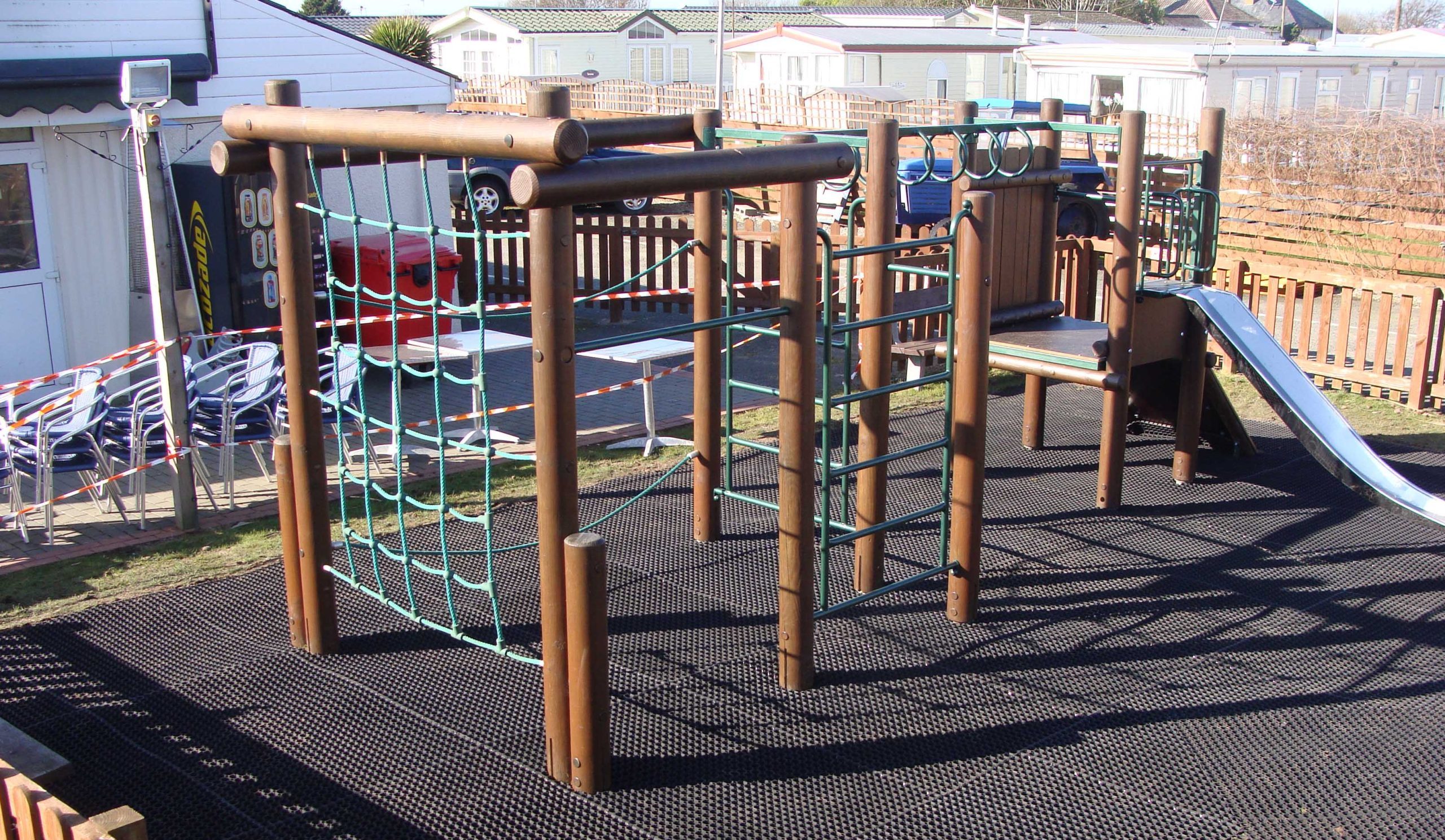 Rubber EcoSmart playground mats under climbing frame