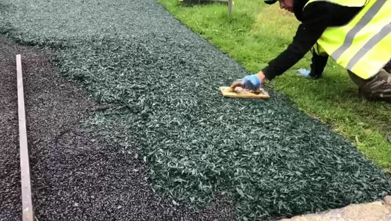 PlaySmart workers installing EPDM rubber mulch surfaces