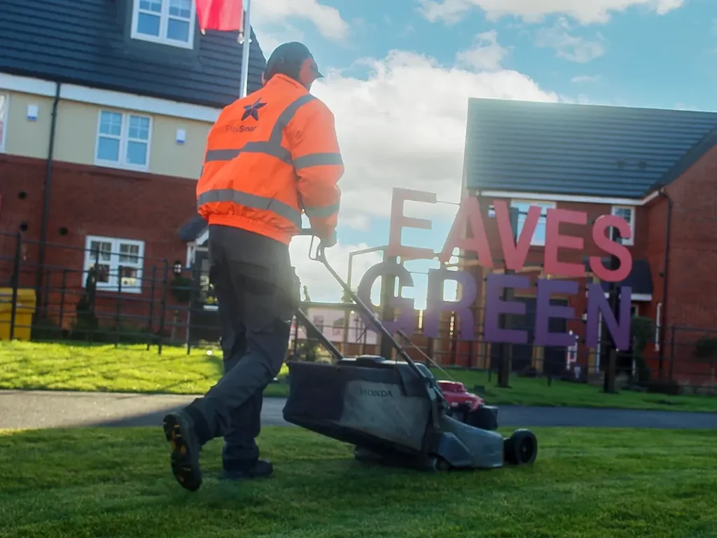 PlaySmart landscaper mowing a housebuilder residential development