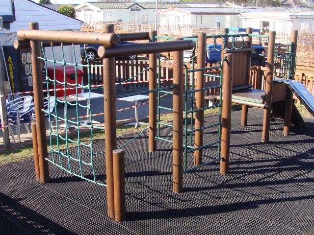 Rubber EcoSmart playground mats under climbing frame