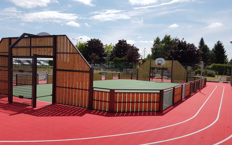 FlexCourt's modular sport surface installed in a MUGA sports court with sports track