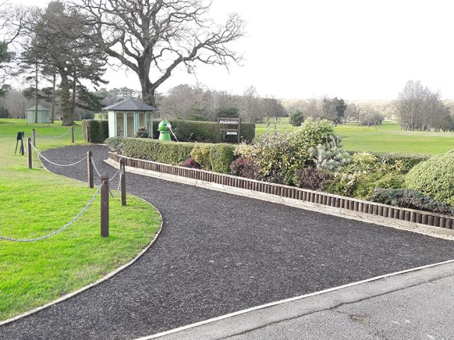 wide grey rubber mulch pathway underlay on golf course