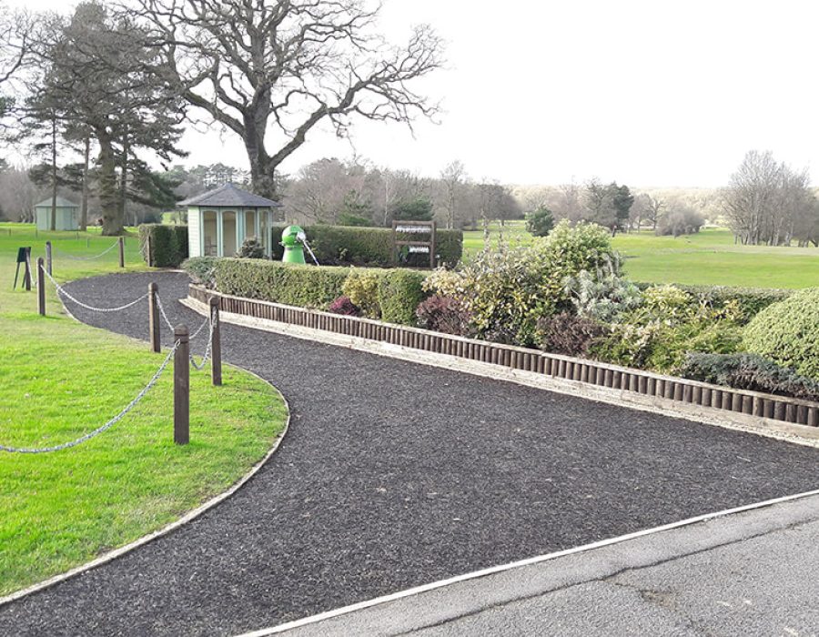 wide grey rubber mulch pathway underlay on golf course