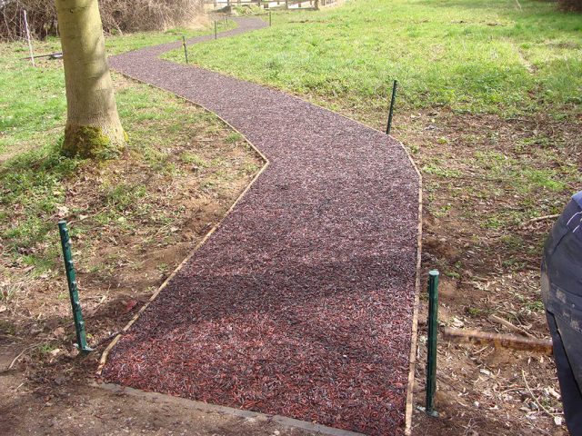 Red JungleMulch pathway with wooden edging