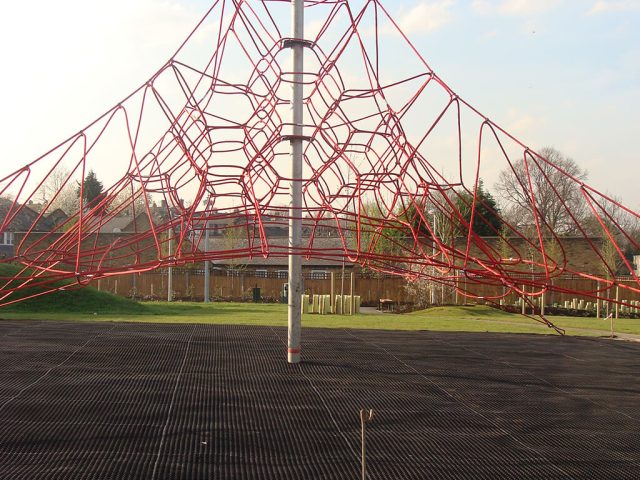 SmartPlay Installation with grass mats underneath red climbing frame