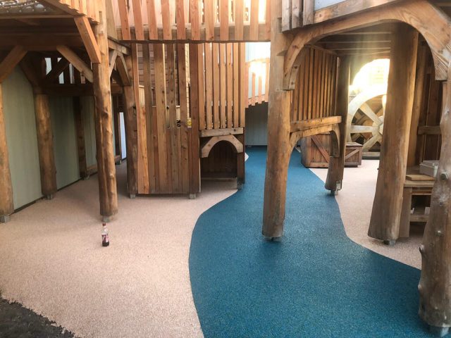 Indoor Playground Blue Pathway under wooden equipment