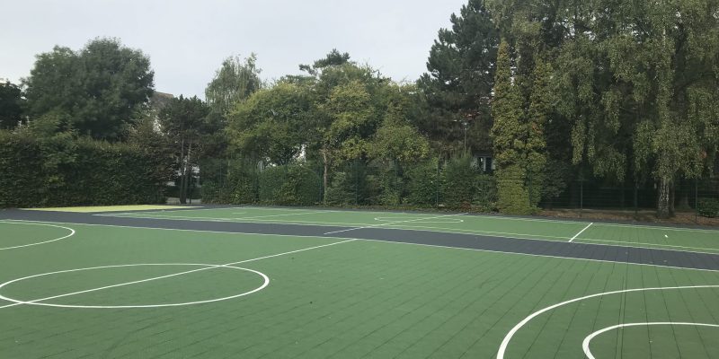 MUGA markings on green Flexcourt