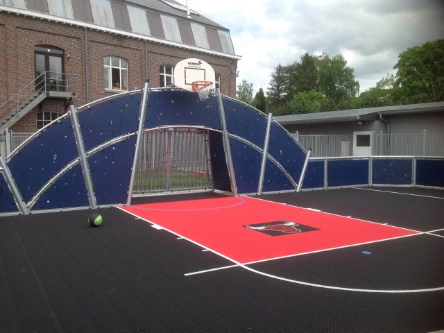 FlexCourt's modular sport surface with custom sports markings installed in a basketball court