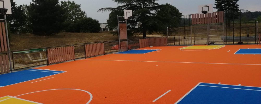 FlexCourt's modular sport surface installed in a large multi-use sports court