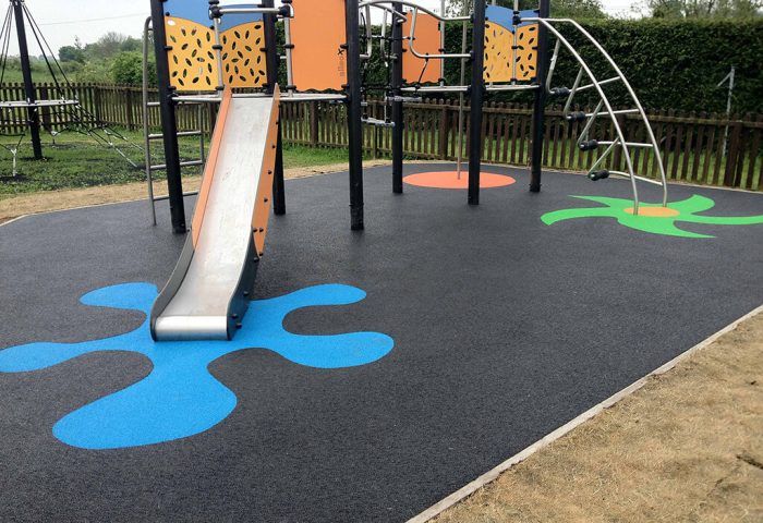 RubbaSmart WetPour playground surfacing with colourful splash markings of EPDM wear pads