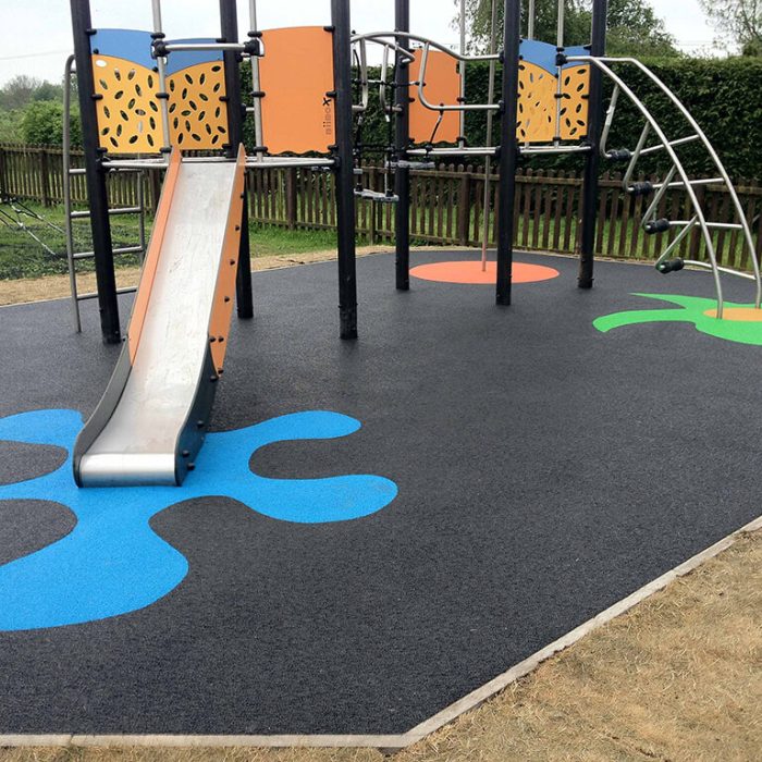 RubbaSmart WetPour playground surfacing with colourful splash markings of EPDM wear pads