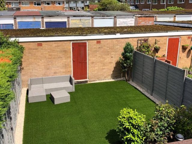 Square of Green Frog Artificial Grass installed in a small walled garden