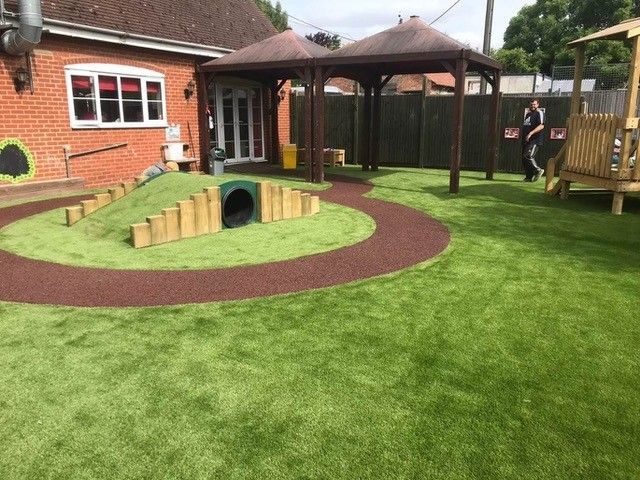 Artificial grass carpet garden with junglemulch pathway