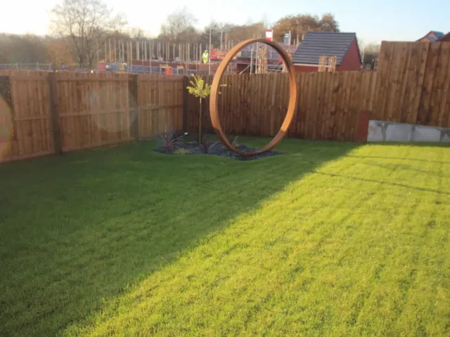Large lawn with circular sculpture