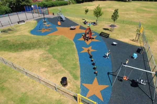 Star Themed Playground with blue and orange rubber mulch