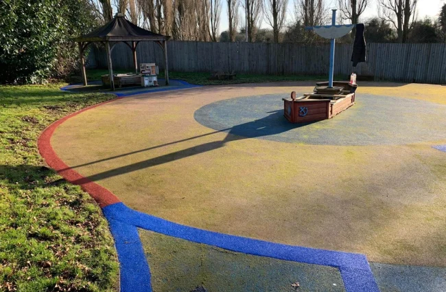 Colourful EPDM edging strips used at the edges of wet pour rubber play flooring