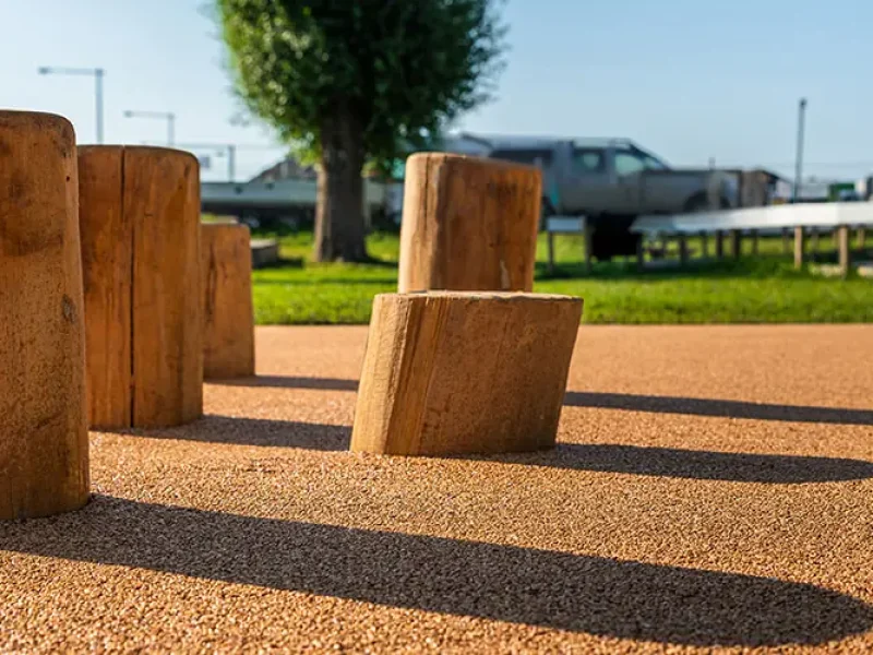 Natural seating logs on Corkeen surfacing