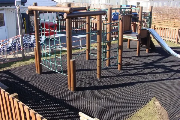 Freshly installed EcoSmart under climbing structure in small play area