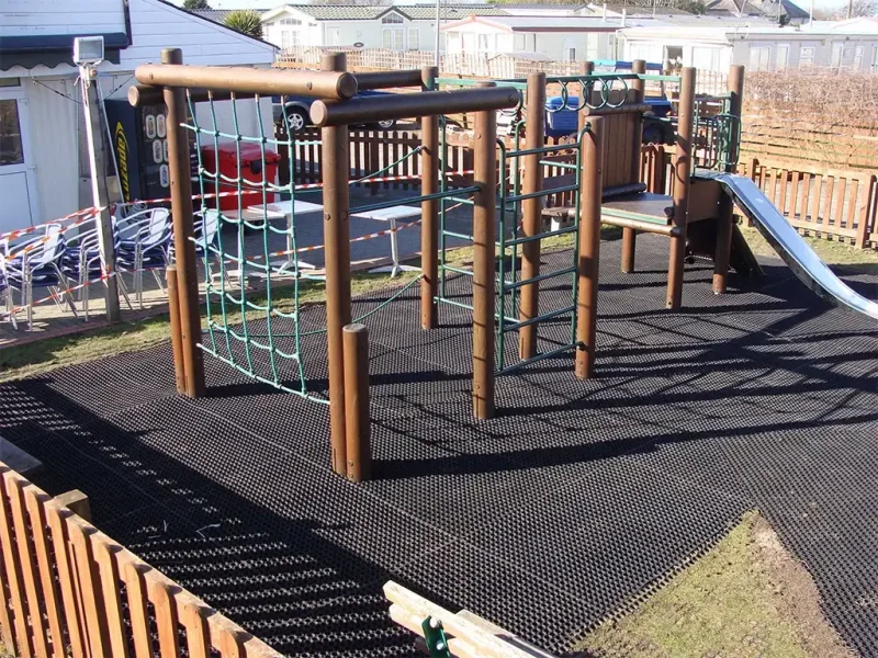 Freshly installed EcoSmart under climbing structure in small play area