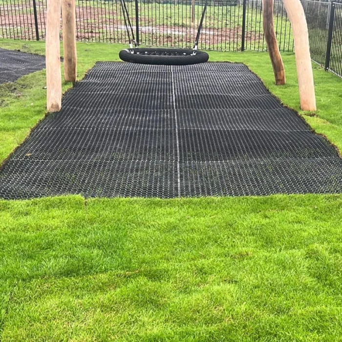 visible grass mat under wooden playground equipment