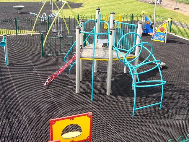 EcoSmart playground grass mats underneath Playground Equipment in Playground
