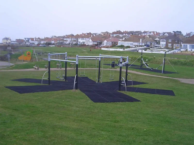 EcoSmart safety flooring below large swing play area outside town