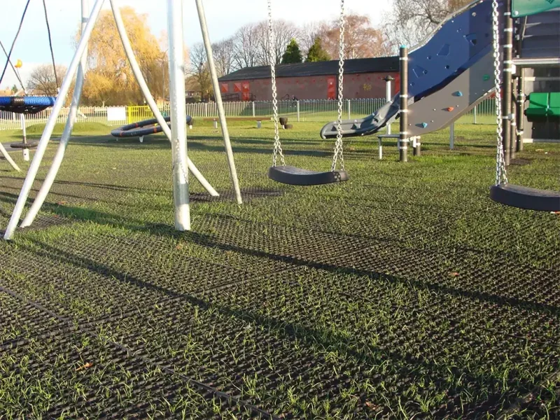 EcoSmart with grass growth in a play area with swings and multiplay structure