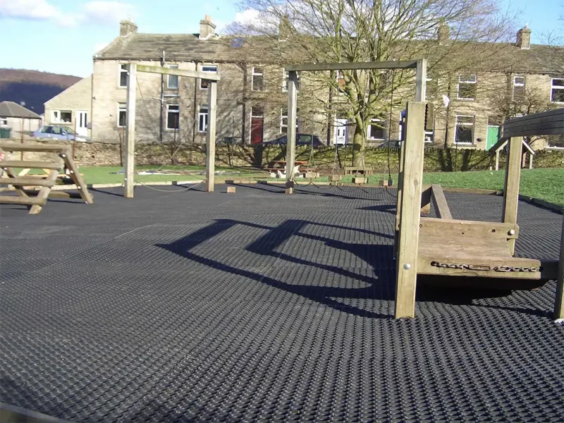 Large EcoSmart installation below a wooden trim trail in a village park play area