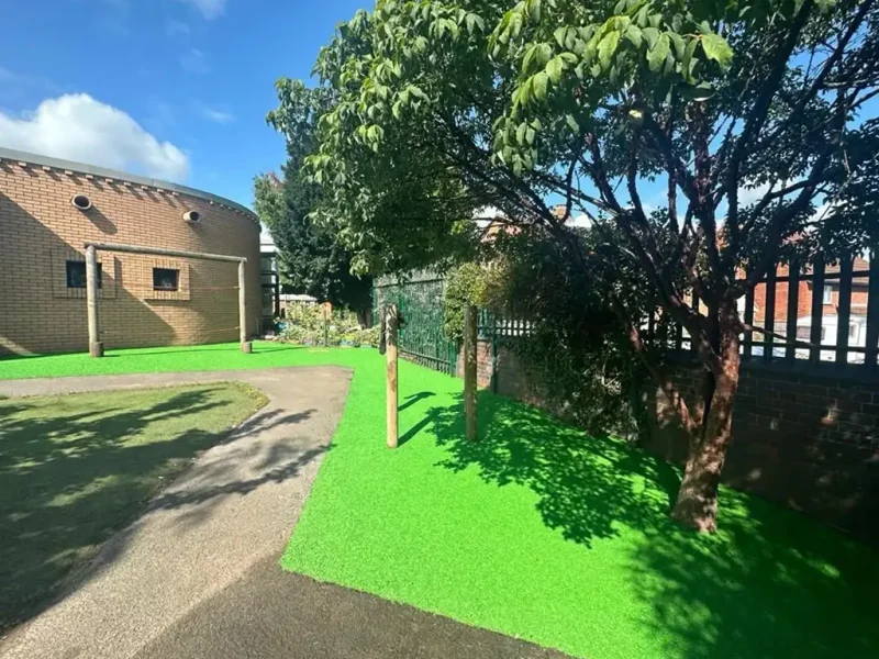 Bright green EPDM Mulch play area with trim trail