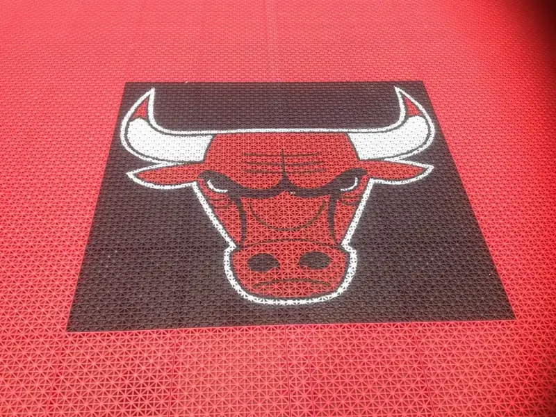 The Chicago Bulls logo in FlexCourt material in a basketball area