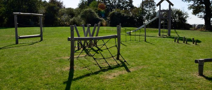 EcoSmart and SmartPlay underneath grass play equipment