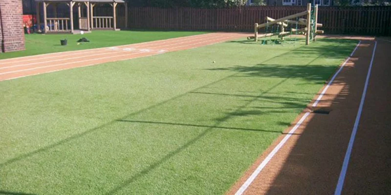 Grass carpet for sports with racing track