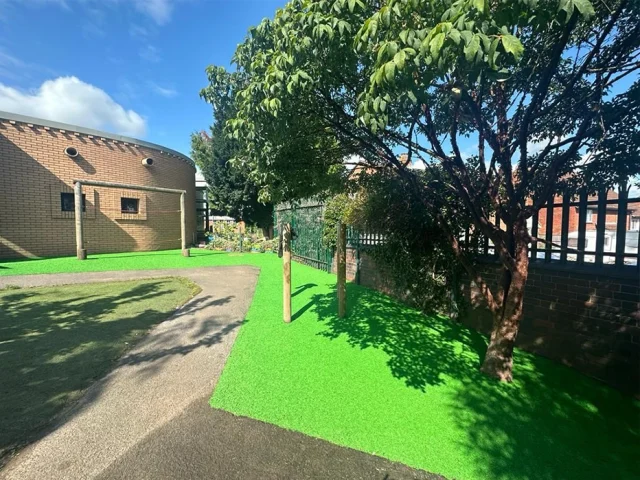 Vibrant green EPDM Mulch under school playground equipment