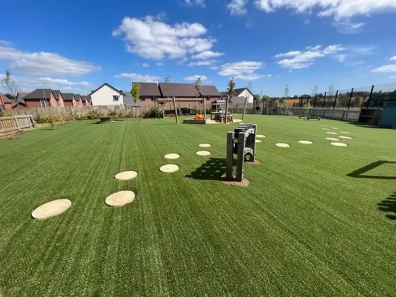 Panorama of stepping stones in a large HybridSmart lawn
