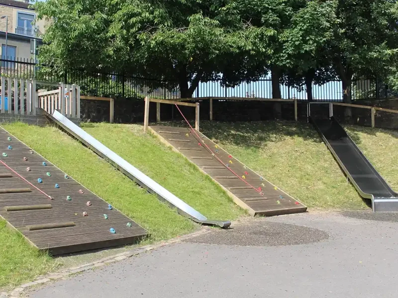 Wide shot of HybridSmart being used at Haworth Primary School on a hill next to slides and climbing equipment