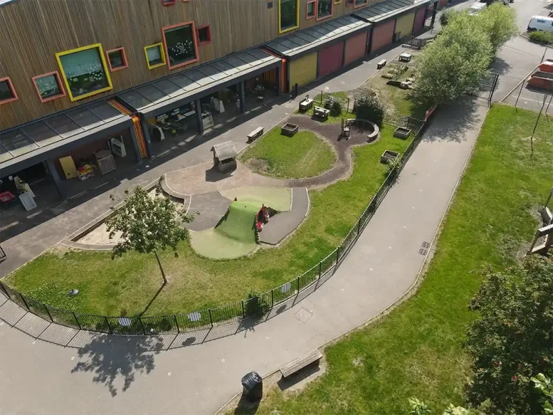Overhead drone shot of Tinsley Meadows Primary School with a HybridSmart lawn and a JungleMulch pathway