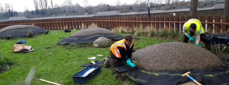 JungleMulch rubber mulch turtle design with installation team